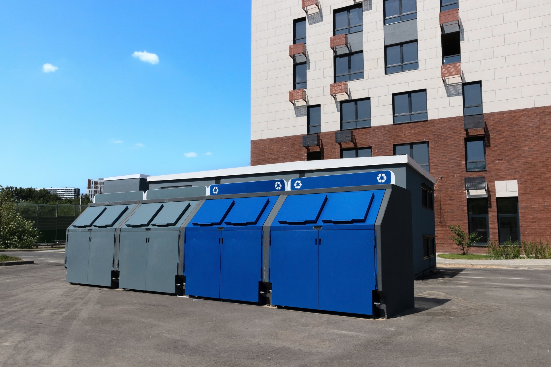 Garbage containers near residential apartment building for separate waste collection and recycle. Eco friendly concept.